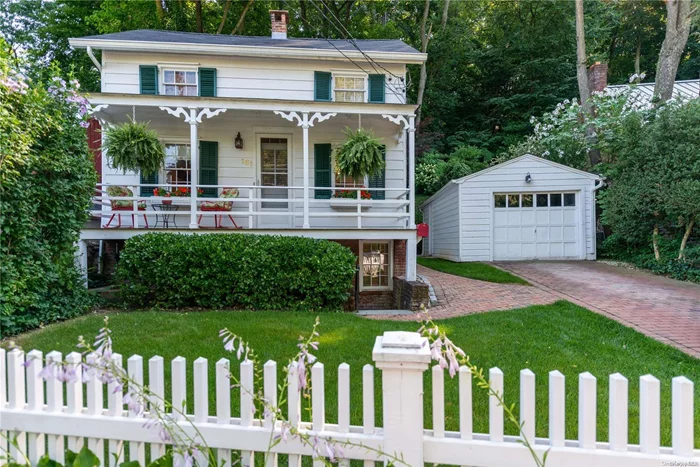 The quintessential village Cottage across from the Duck Pond and Gerry Park in the Historic District of Roslyn. A white picket fence invites you in to this updated and move in ready home. Enter directly into the Living Room with gorgeous wood floors, a wood burning fireplace and walls of windows overlooking the perennial gardens. A spacious, original dining room with beamed ceiling and many windows for natural light. The eat in kitchen has a door to the front porch for your morning coffee or evening glass of wine. The extended primary bedroom with wood burning fireplace and dressing area. A second bedroom with a wall of closets and full hall bath completes the upper level. An outside entry into the lower level is ideal for a home office, guest suite or den. with full bath. Why rent when you can own a special home in the Historic District of Roslyn. Convenient to the town with some of Long Islands finest restaurants ...Save gas by leaving your car at home., Additional information: Appearance:move In, Separate Hotwater Heater:Y