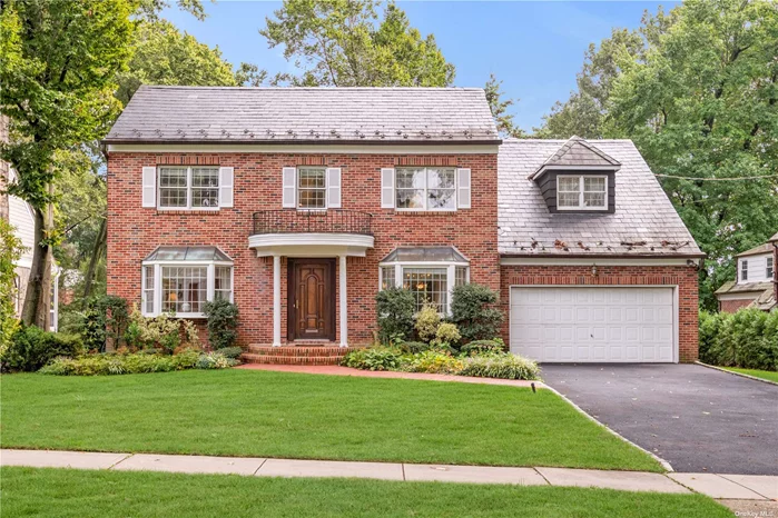 Welcome home to this impeccably maintained brick and cedar shingle center hall colonial in Munsey Park. This 3, 000+ SF home includes spacious & oversized principal areas, gleaming hardwood floors, an immense, sun drenched family room with soaring ceilings and wood burning fireplace, and an extensive eat-in kitchen with an abundance of cabinet space, granite countertops, top of the line appliances, and breakfast area. 2nd floor boasts a bright & sunny landing overlooking the family room with a palatial Primary Suite with WIC, dressing area, en-suite bath plus 3 bedrooms with a hallway bath, ideal for todays modern living. Full basement, updated exterior lighting, electric, brick pavers in rear. The picture perfect home situated in the heart of Munsey Park within close proximity to all Manhasset has to offer.