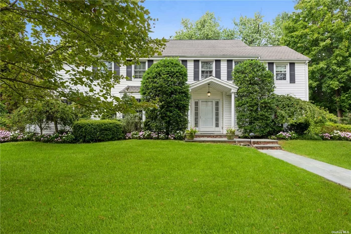 Welcome to this impressive sun-filled colonial home on a quiet tree lined street. The open foyer with beautiful wood floors welcomes you into the home. Enjoy entertaining in the spacious formal living room with wood burning fireplace. The large den is filled with sunshine beaming through the skylights. The cozy sitting room is perfect for some quiet time or can be made into an office. Enjoy cooking in the bright eat in kitchen, with picture window to the backyard and generous center island. Have a quick meal at the kitchen table with views of the garden or a traditional meal in the formal dining room. Laundry room and powder room complete the first level. Head upstairs to the primary bedroom with walk in closet, skylights and on suite. Down the hall is a bedroom with full bathroom, perfect for guests. Two more spacious bedrooms with hallway bathroom complete the second level. The wine cellar is a must see. Two car detached garage with lovely loft above. Prime location in the Village.