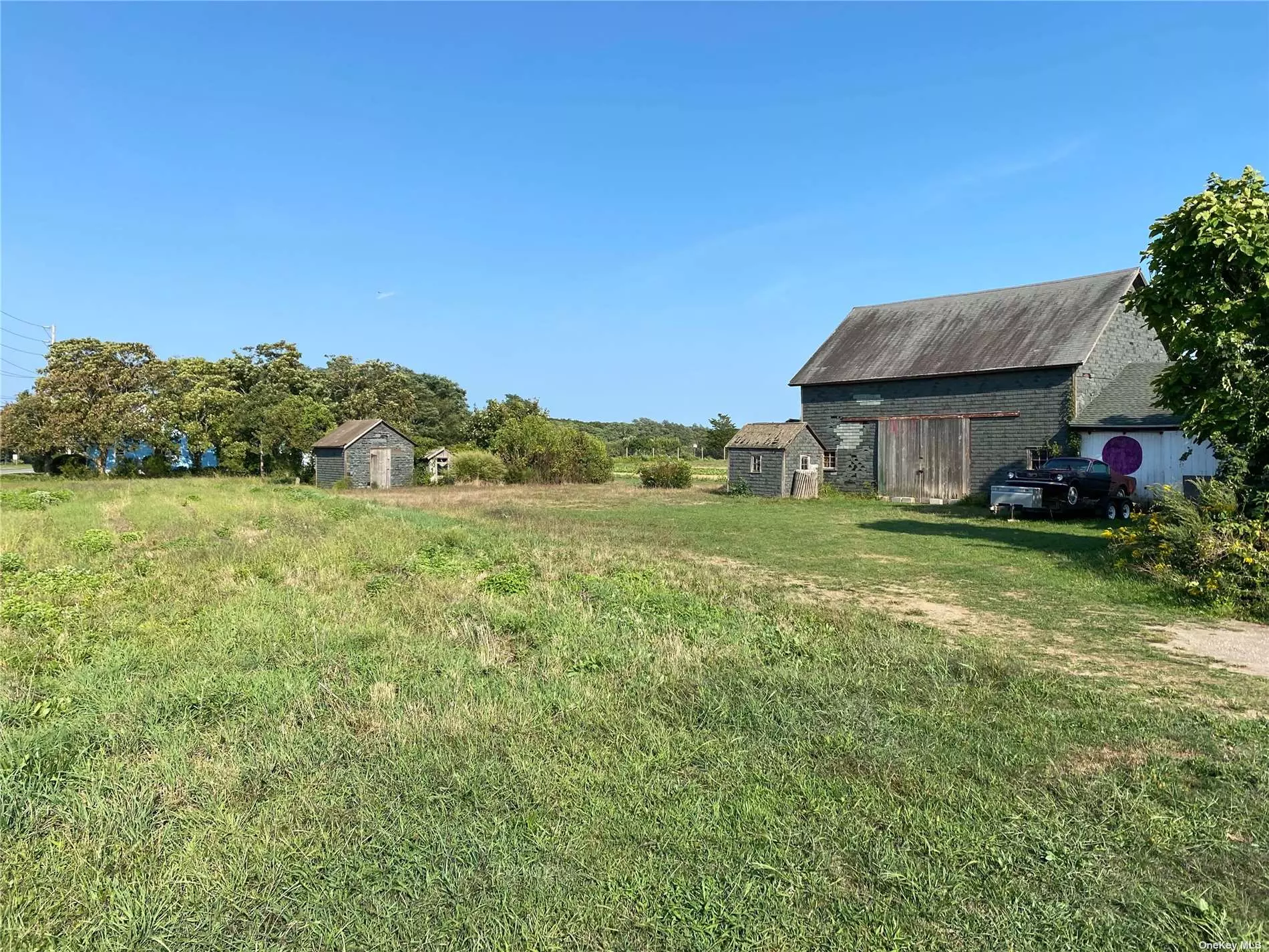 Prime, cleared +3 bucolic acres overlooking farmland and vineyards in the heart of Cutchogue. Plenty of room for a house, pool, and more or ideal for agricultural growing. Pre-CO exists for barns and sheds but all information must be verified independently by the buyer. Zoned A-C (Agricultural-Conservation) Bring your imagination and come build your North Fork dream home! Please do not enter the property without an appointment as it is being actively farmed.