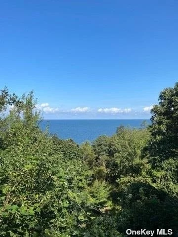 Incredible opportunity to own this waterfront home with exquisite views. This 3bedroom, 2 bath ranch with full finished basement, tankless propane water heater and fireplace is part of the Beach Club Civic Association($250/yr dues). Journey down the backyard steps to your own private oasis. Peconic tax applies. A must see!!