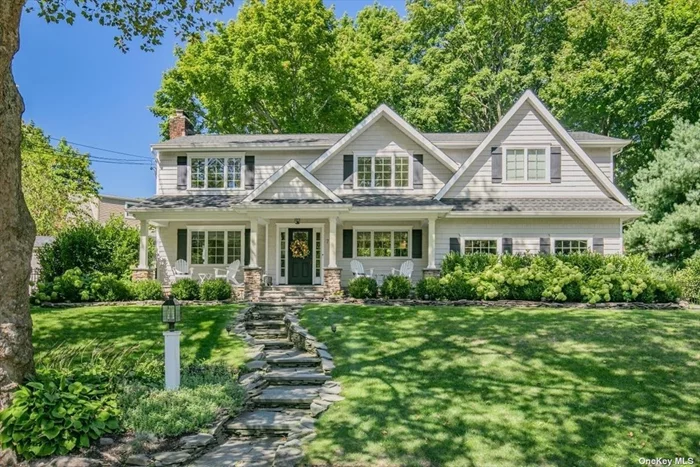 Nestled down a quiet tree lined street at the end of a cul-de-sac, this newly renovated 3000sqft home is just footsteps away from Mill Pond, Bird Island & Northport Harbor. The charming front bluestone porch gives the quintessential charm of design for this soft farmhouse colonial on a private cul-de-sac. The main floor is open & flooded with natural sunlight & hardwood floors throughout. Walk right into the living room, showcasing a wood burning fireplace, which flows seamlessly into the beautiful eat in kitchen with custom built-ins. The expansive primary suite is tucked away upstairs with a massive walk-in closet, along with 3 additional oversized bedrooms, one of which is a suite as well. Enjoy this private, manicured country club like backyard with a bluestone patio, pergola, outdoor fire pit & plenty of yard space. Five zone sonos system 2-car garage & basement - storage galore! Do not miss out on this one!