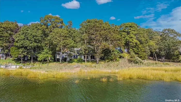 Mid Century Multi Level Bayfront, 4BR, 3.5 baths home located in Bay Woods, Association Bay Beach two minutes away. lovely treed location offers privacy, glorious waterfront views to the southwest , enjoy cooling summer breezes&rsquo;