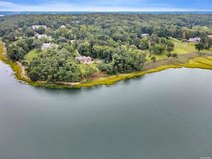 Nestled on 5.25 glorious waterfront acres.
