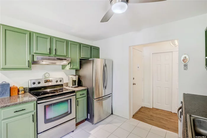 Forest Green development. This beautifully updated second floor unit overlooking the courtyard has stainless steel appliances, new floors and an in unit washer/dryer. The complex features a club house, in ground salt water heated pool, and gym. Maintenance includes taxes, heat, and hot water.