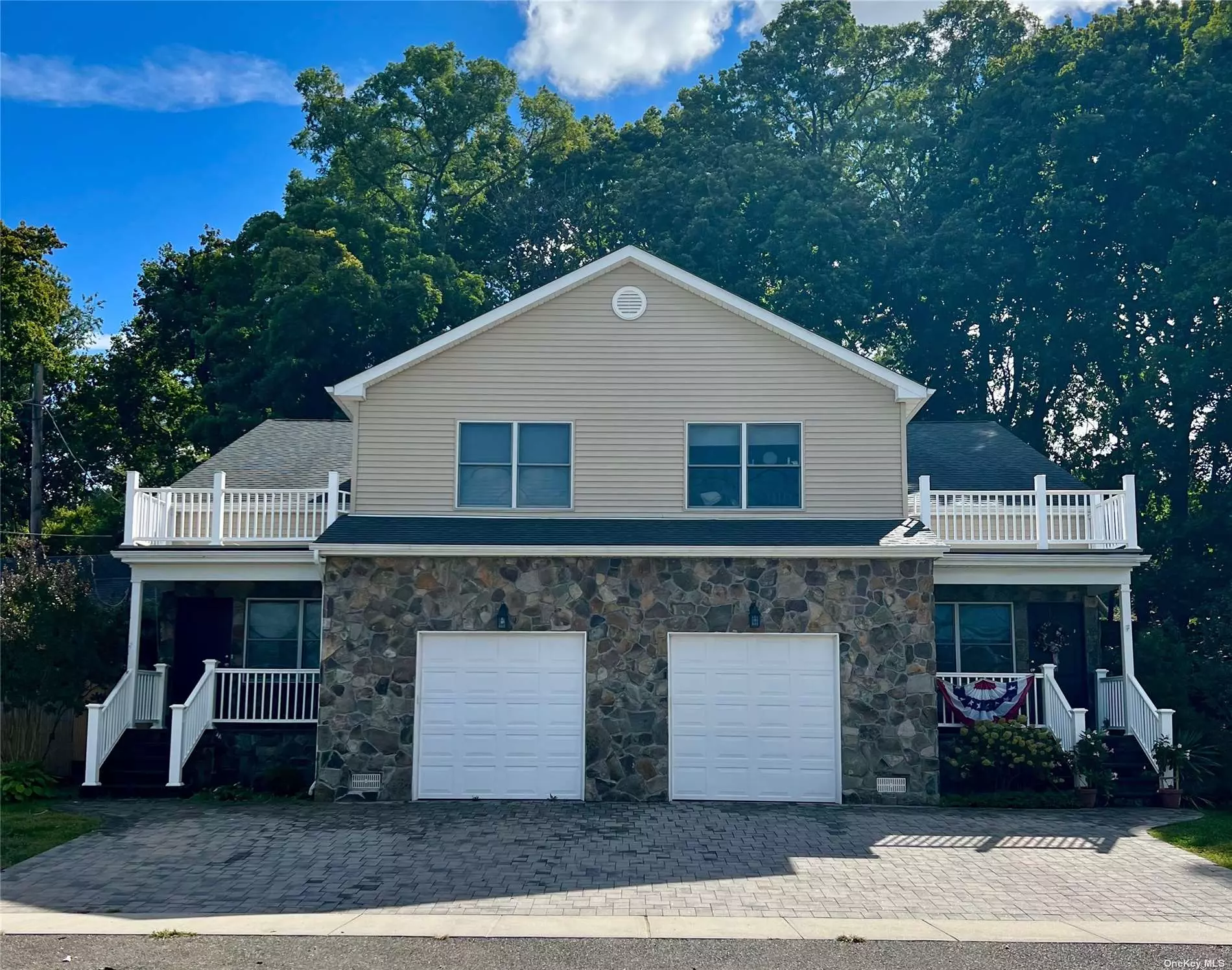 Great Opportunity To Purchase This Side By Side 2 Family Home. Home is 8 years Young, With Water Views And Close To Beaches, Parks, Restaurants, Boating, and the Glen Cove Village. Each Side Offers A Welcoming Porch Leading To a Living Room, Formal Dining Area, Half Bath, Garage Access, and Eat In Kitchen With Sliding Doors To A Deck. The Second Floor Has a Primary Suite with Bath and Balcony Access. In Addition there are 2 sizable Bedrooms and a Full Bath. Wonderful Opportunity To Rent Both Sides or Live In One And Rent The Other.