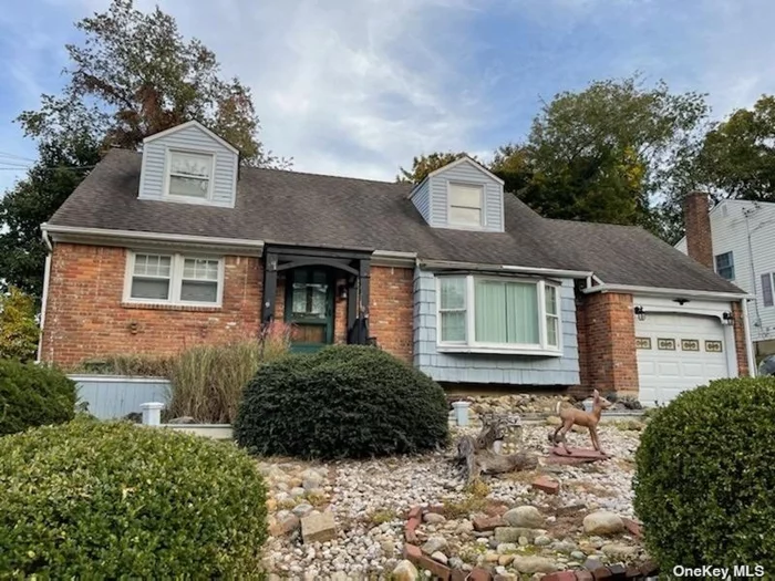 Awesome brick cape with large dormered bedrooms upstairs. Beautiful Oyster Bay!