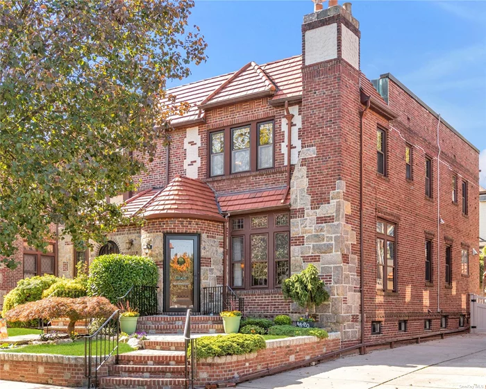 Elegant and traditional English Tudor in the heart of Bayside Hills. Built in 1935 by highly regarded Kings Developers and nestled on a quiet tree-lined street, This quintessential 1 family, brick and stone, SD residence offers the perfect blend of old world charm with todays modern living. The main level features beautifully maintained hardwood oak floors, restored maple and mahogany mill work throughout, soaring 10 1/2 ft ceilings in the LR, and spacious formal DR with custom trim work and paneling. Bright and airy updated EIK with custom cherrywood cabinetry, granite countertops, and stainless steel appliances. 2nd floor boasts 2 bedrooms, full hallway bath w/ double vanity, and a considerably sized Primary Suite w/ 2 large closets and en-suite bath. Full finished basement w radiant heating, office, full bath & laundry room. Private & fenced rear yard w/ covered patio and pavers. Prime, mid block location. Close proximity to LIRR, highways, parks, shopping & restaurants.