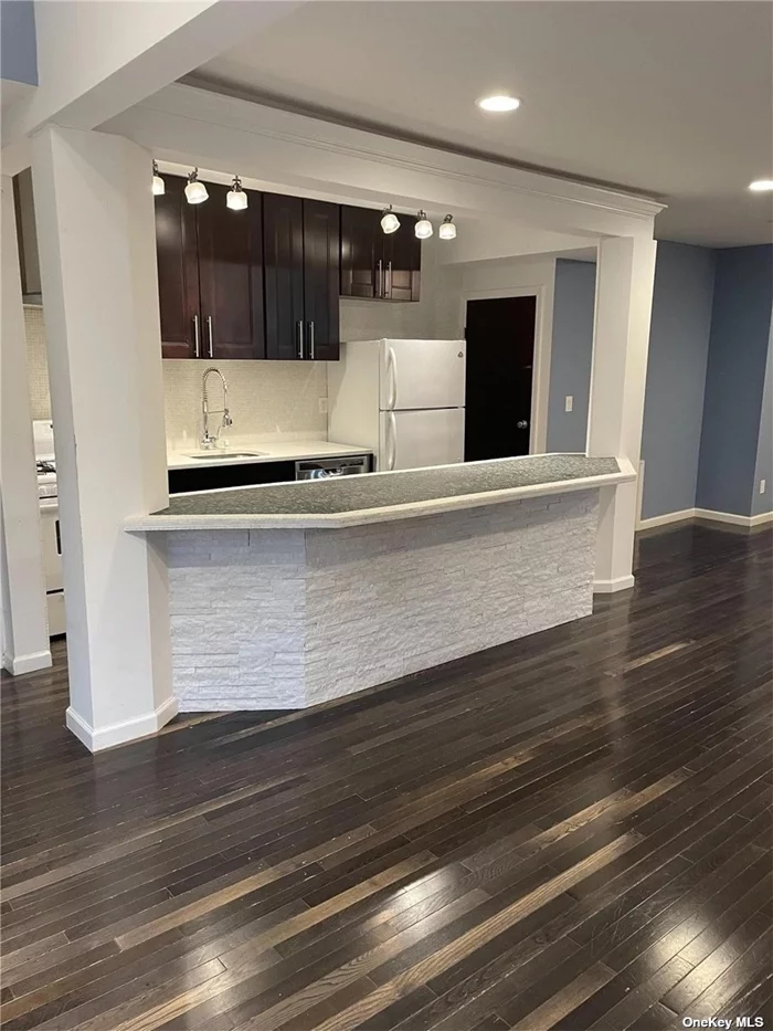 Completely Updated -- all new kitchen, bath, windows, hardwood floors. Use of private backyard and laundry. One car garage and driveway. Close to transportation and all.