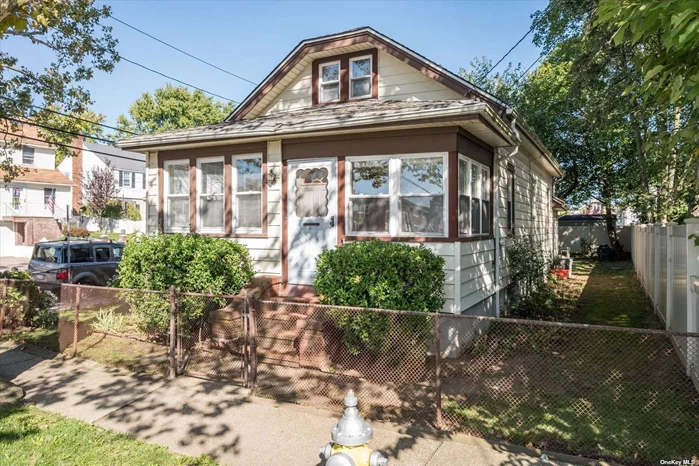 Come make this lovely bungalow cape home your own. It sits on a nice sized corner lot with a spacious yard and detached garage. The house has many lovely original touches. The second story walk up attic currently functions as a 3rd bedroom with adjoining office area. The updated kitchen with modern appliances leads to a mudroom that accesses the back yard. An unfinished basement offers a tremendous amount of storage space. Located in Franklin Sq. North of Hempstead Turnpike it is close to shopping, restaurants and transportation. Lots of potential. Call today for a private viewing.