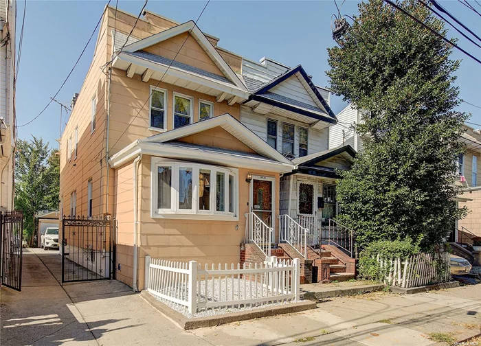 Semi-detached colonial in a prime area of Woodhaven, Queens. This home sits on a 20 x 100 lot and provides approximately 1, 300 sq ft of living space. First floor features a sunny entry foyer with separate sitting area, a spacious living room, formal dining room, a large upgraded eat-in kitchen, upgraded half bath and hardwood floors throughout. The kitchen has access to basement, and separate entrance to backyard. Second floor features 3 full size bedrooms, upgraded bathroom and hardwood flooring. Basement is fully finished and has a full bathroom w/ stall shower, laundry room, a bonus room for private office and/or recreation space. Basement can be accessed from outside separate yard entrance. Exterior features include private fenced backyard and detached 1 car garage accessible by a shared driveway. This home is conveniently located close to shopping, transportation and other amenities. Forest Park is just 5 blocks away.