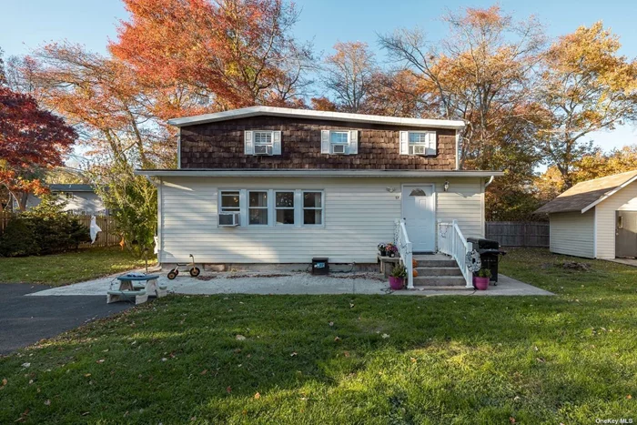 Relax in this cozy three bedroom, two bath colonial only one block from the great South Bay. This corner lot offers a quiet tree line street.
