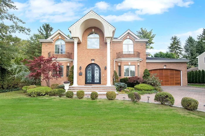 Stately BRICK Colonial with Dual Front Balconies and Grand Entry with High High and Fabulous Curved Stairway to Second Floor. Entry and Gourmet Eat in Kitchen with Center Isle, Wolf Stove/Double Oven, Sub Zero Refrigerator, Prep sink, Granite Counters Breakfast Area and Sliding Doors for Easy Access to Covered Patio/Porch. First Floor has Guest Room with Full Bath and Laundry Room. Second Level Features 4 Bedrooms All with Full Baths. Oversized Master Bedroom with Trey Ceiling, Walls of Glass, Jacuzzi and Shower. 2nd Master Bedroom has Vaulted Ceilings, Walk in closet and Full Bath. Bedroom 3 Also Has Vaulted ceiling, Walk in Closet and Full Bath. Fourth Bedroom also Has Full Bath. Full Finished Storage Basement With Many Options.