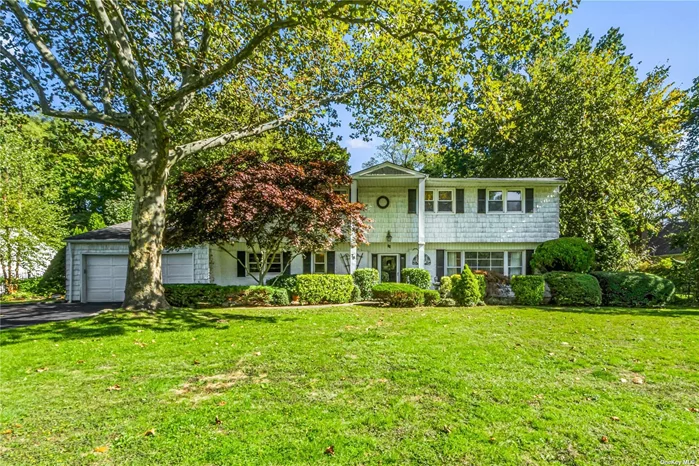 Bright and Spacious Colonial Situated on Half an Acre of Park Like Property With Prime Mid Block Location. This Home Boasts 4 Bedrooms and 3 Full Baths. Open Foyer Leads to Large Living Room With Cathedral Ceiling, Fire Place and Dining Room. First Floor Includes Bedroom/Office, Kitchen, Family Room and Sun Room Overlooking Large Brick Patio and Flat Rear Yard Perfect for Entertaining.