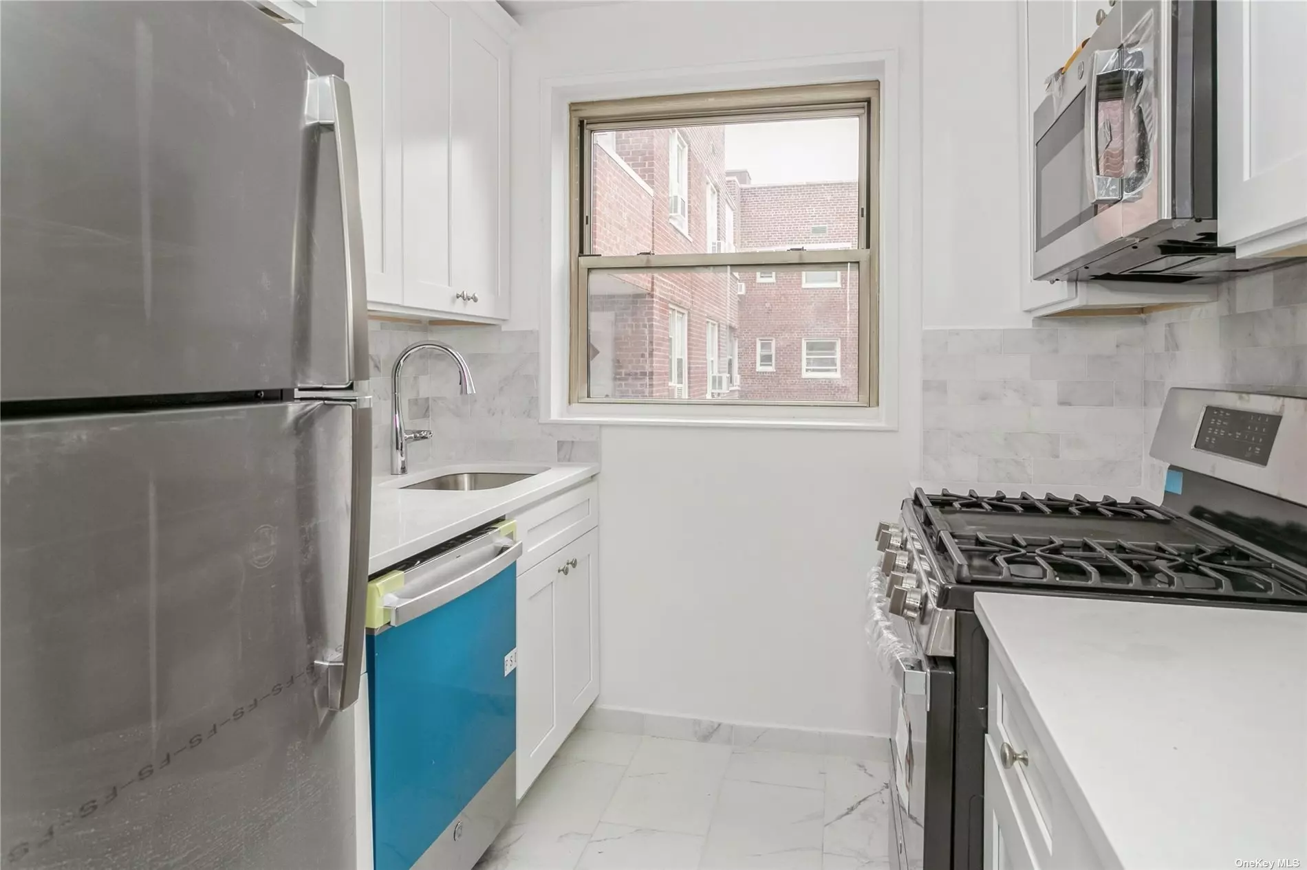 New renovated apartment with new kitchen and stainless steel appliances. New bath with walk in shower. New high hats, hardwood floors throughout. Lots of closet space. Separate dining area. High floor with lots of light. 16 Hour doorman. Garage Parking short waitlist.