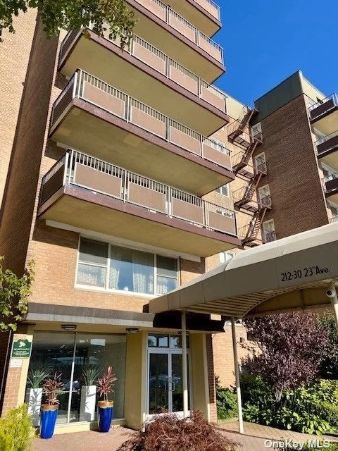 Stunning XL (1200sqft) top floor corner unit. 2 Bedrm 2 Renovated Full bath Coop w/ large pvt balcony, huge private pool (Full Time lifeguard). ALL Utilities incl as well as pool maintenance. Beautifully Renovated kitchen with Granite countertops, Hardwood Custom cabinets & breakfast bar. Master bath w/ Rain shower & cross body shower jets. Beautiful built in bookcases. Custom closet organizer in the master walk in closet. Absolutely perfect location, walk to EVERYTHING! Bay Terrace Mall is a one min walk away. Mall is home to Restaurants, Home Goods, AMC Movie Theater, and so much more. Express bus to Manhattan, library, and Tennis club are all just steps away. LIRR is nearby. Coop private gated pool has changing rooms and bathrooms. Apt has 3 zones for heat and AC, tons of large closets. If you love sunsets, this should be your next home. Indoor and outdoor parking (waitlist). The owner is willing to repaint the unit. Amazing school district. Bell Blvd shpping district is mins away.