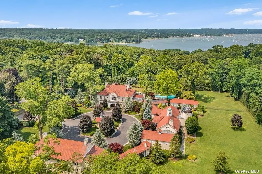Once in a lifetime opportunity to buy the former estate of Tennis Legend John McEnroe! Absolutely Breathtaking 20, 000 sq ft Palatial Gold Coast Compound, with a star-studded history, sitting on a majestically manicured & park like 4+ acres. Gated entry leads into a circular driveway with clock tower centerpiece. This breathtaking estate features a 10, 000 sq. ft. 4-bedroom Main House with an elevator, spa, gym, & a wine room, a pool house, a 1-bedroom guest cottage, a carriage house with 2 bedrooms, a ballroom & a movie theatre, and a 4+ car garage, with 3-bedroom apartment space. The grounds also feature an in-ground saltwater heated gunite pool with blue stone patio and built in BBQ, a tennis/sports court, a full playground, & generator, which powers the entire estate. So many more details and high-quality finishes to mention - call broker for private showing.