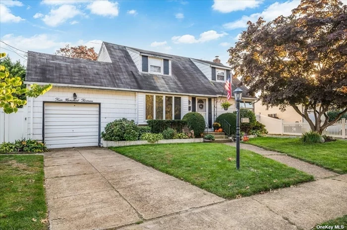 Located in Massapequa Park, this charming Westwood Cape boasts a full rear dormer, three bedrooms, one of which was converted into a laundry room, and two full bathrooms. This home is located near East Lake Elementary School just off Carmens Road, near stores, restaurants, shopping, and the LIRR. The home has East-West sunlight all day long, wood flooring, and landscaping with perennial flowers that bloom from March through October. The 70x118 lot has a large backyard and an enclosed porch/sunroom in the rear of the home, which is suitable for year-round living. A natural pergola with grape vines and a firepit area are featured in the backyard. 1 car attached garage, partially finished basement with additional storage.