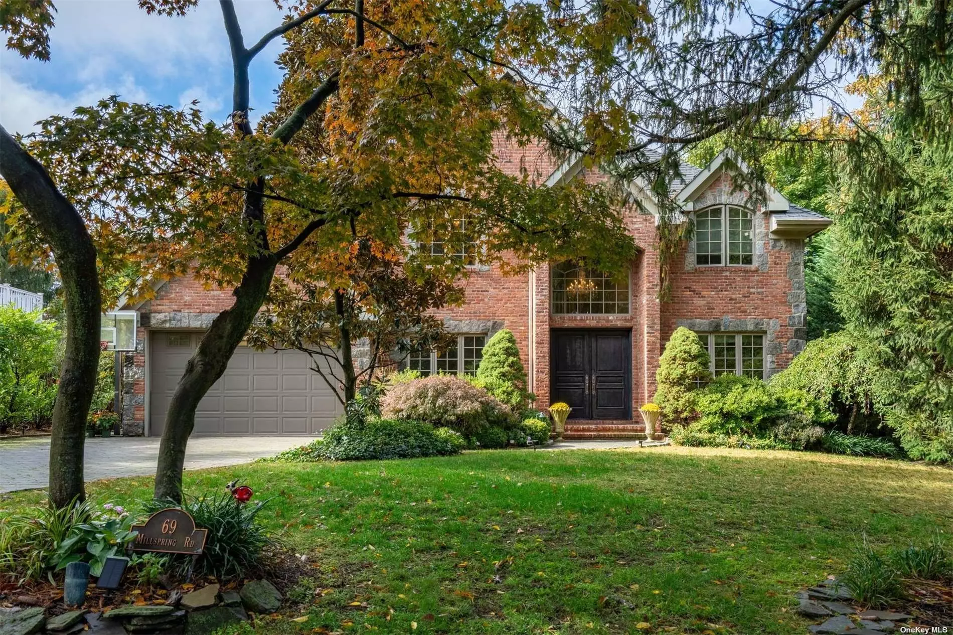 Welcome to this remarkable Red Brick Colonial in South Strathmore. Featuring 4 stately bedrooms, 2 luxurious full baths plus 2 half baths, and ample natural light throughout. Enjoy cozy evenings by the living room fireplace or entertaining guests in the elegant formal dining room. The European gourmet eat-in kitchen adjoins a spacious den w/fireplace & custom built-ins. 2nd level boasts 4 bedrooms w/soaring ceilings & extra-large walk-in closets. Lower-level features exercise area/gym, quiet home office, half bath & ample storage. Tastefully appointed with custom moldings, built-ins, central vacuum, and much more. Magnificent tree-lined backyard & patio area makes this home feel like your own private getaway. A must-see to appreciate its beauty and elegance!