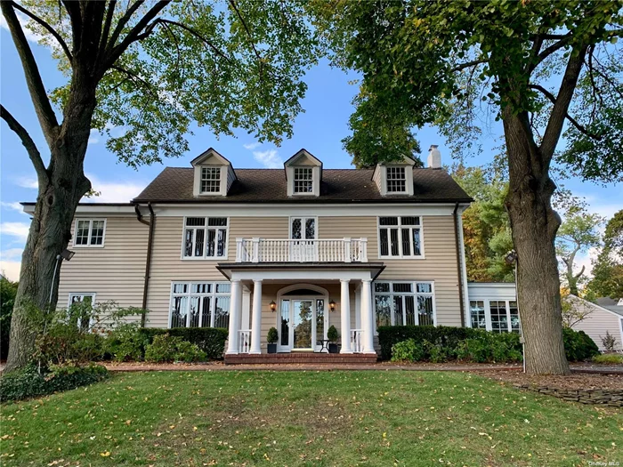 Architectural Gem! Beautifully maintained center hall colonial with leaded glass windows, parquet floors, grand ceiling height and large entertaining rooms on the main floor. Lovingly maintained and improved with an appreciation of its period architecture and finishes, this home has a very private setting on four-tenths of acre and is within walking distance to Munsey Park school and fields. Rare opportunity!