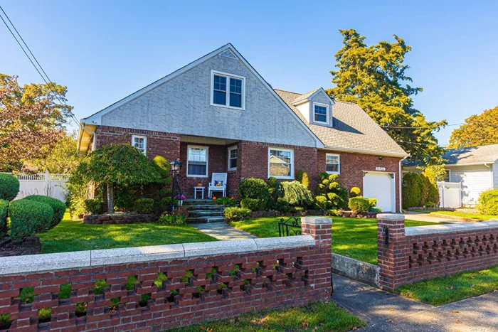 Charming brick expanded cape 5 bedroom,  2 full bathroom,  finished basement, hardwood floors, new kitchen, central air, Large property with in ground pool beautifully landscaped.