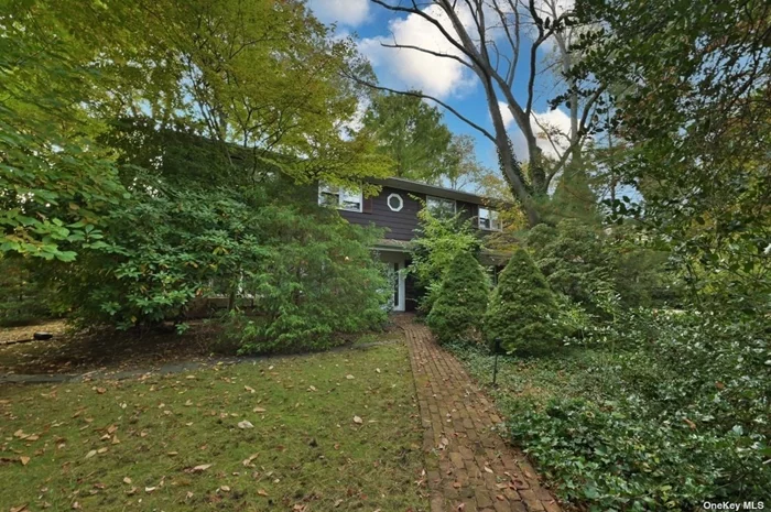 Take advantage of this special opportunity to create your dream home in the sought-after community of Flower Hill Manhasset! This home provides a sense of park-like privacy yet close to everything Port Washington from shops and schools to the Long Island Railroad and Americana shopping center. Enjoy a flat half acre with walking paths and koi pond.  Tree-top views from the primary suite with sun-drenched sitting room and humongous walk-in closet.  Original owner for 65 years! Being sold as is.