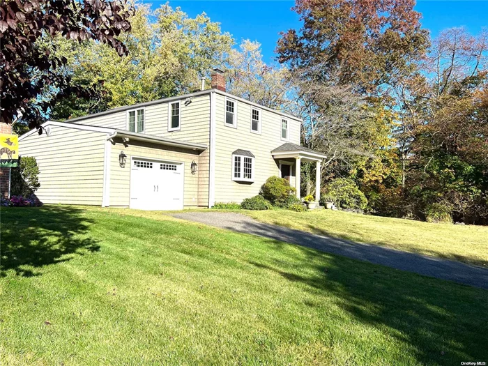 Wonderful, side hall, colonial on almost .5 acre. 4 bdrm/2 bath. The entire back of the house has been expanded on both 1st and 2nd floors. Huge master Br with 12ft ceiling with 2 walk-in closets, 3 Family sized bedrooms with good closet space. 4th bedroom on first floor-or use as den/playroom. Bright, open living room . All hardwood floors on first floor. Eat-in kitchen w/ SS app. Banquet sized dining with fireplace. Attached 1.5 car garage has been completely rebuilt. Central air, Gas Heat. Finished basement. big backyard and side yards. Roslyn Schools, Additional information: Appearance:excellent, Separate Hotwater Heater:yes