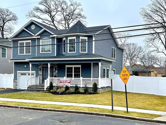**JUST COMPLETED W/ BRAND NEW C-OF-O (by Jan. 2023)!** Totally Brand-New Custom Colonial w/ Wraparound Front Porch & NEW FULLY PVC-FENCED BACK+SIDE YARDS On Prime Massapequa Woods 7, 000 SqFt Property THAT IS HIGH & DRY-- NOT IN FLOOD ZONE! Listing Photos Are Of The Actual Home completed Jan.2023 By QUALITY Builder w/ 30+ Yrs experience & Over 400 New Homes Built-To-Date. WALK TO LIRR Station & Award-Winning Massapequa SD#23/Fairfield Elem. Home Has Approx 3100 Total Int SqFt of Open Floor Plan (+Wraparound Frt Porch & Huge Bsmt w/Outside Entrance) Truly Professionally Designed & Finished w/ The Utmost Quality Of Craftsmanship. True Master Bdrm Ensuite w/ Dbl Walk-In-Closets, Designer Baths (1full on 1st flr + 2full on 2nd flr), Custom Eat-In-Kitchen w/ Prof SS Appliances + Pantry Closet, Pella Wdws, Flawless Trim-Work Throughout, Surr Sound Pre-Wired, Big 1-Car Gar, Gorgeous Landscaping + UG Sprinklers System, Nat&rsquo;l Grid Gas (heating/cooking/dryer), Energy Star/HERS-Rated Home, +MuchMore... NO AMENITIES SPARED! The Next Door You Open Will Be That Of Your Dream Home!