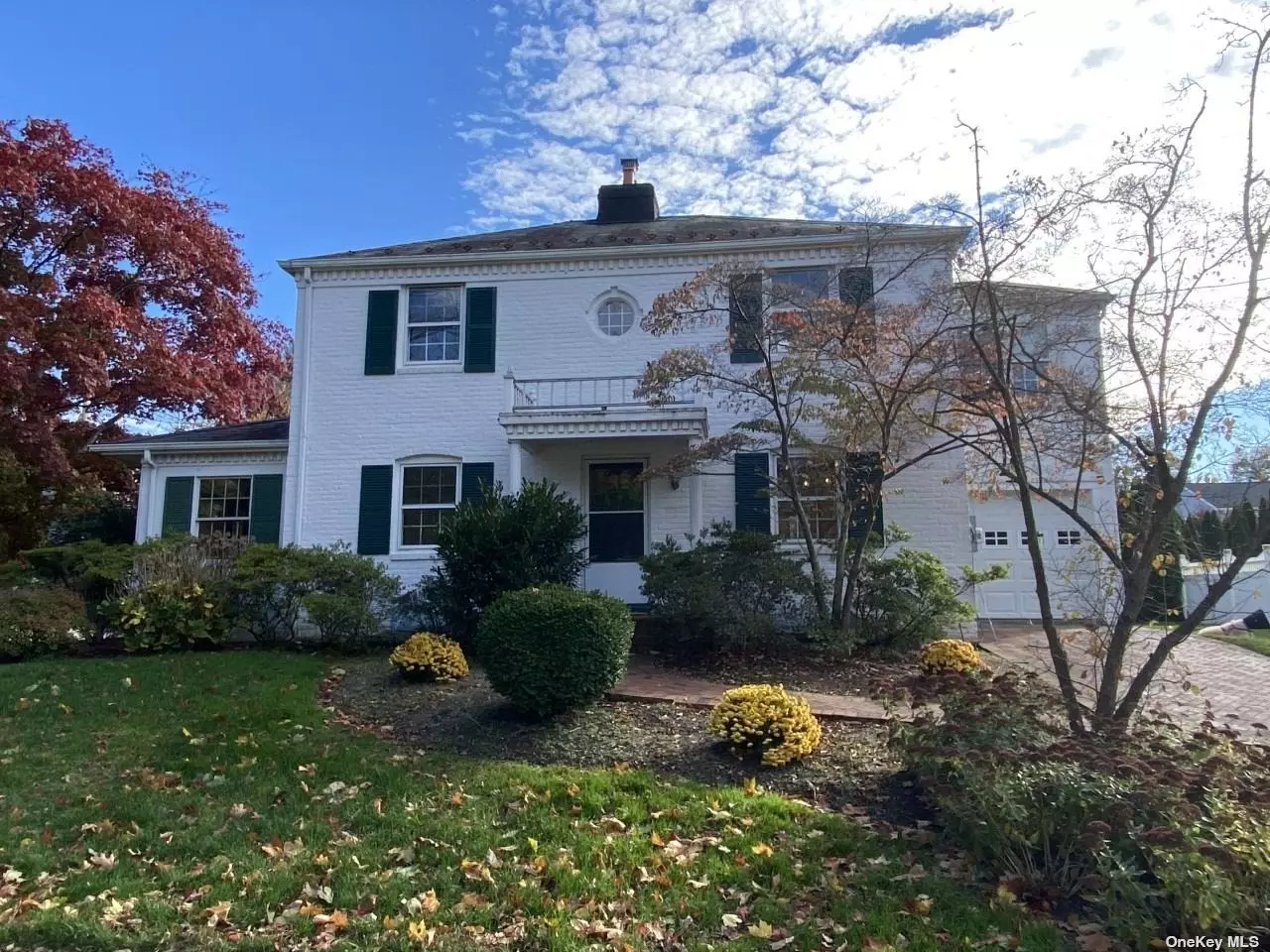 Brick & Stucco Center Hall Colonial nestled on a corner property. Hardwood floors, formal living room w/wood burning fireplace, formal dining room, eat-in kitchen with sliders to brick patio, den/family room and powder room complete the 1st floor. The second floor includes 4 bedrooms and 2 full baths. Convenient to park, shops, LIRR station and secondary schools.