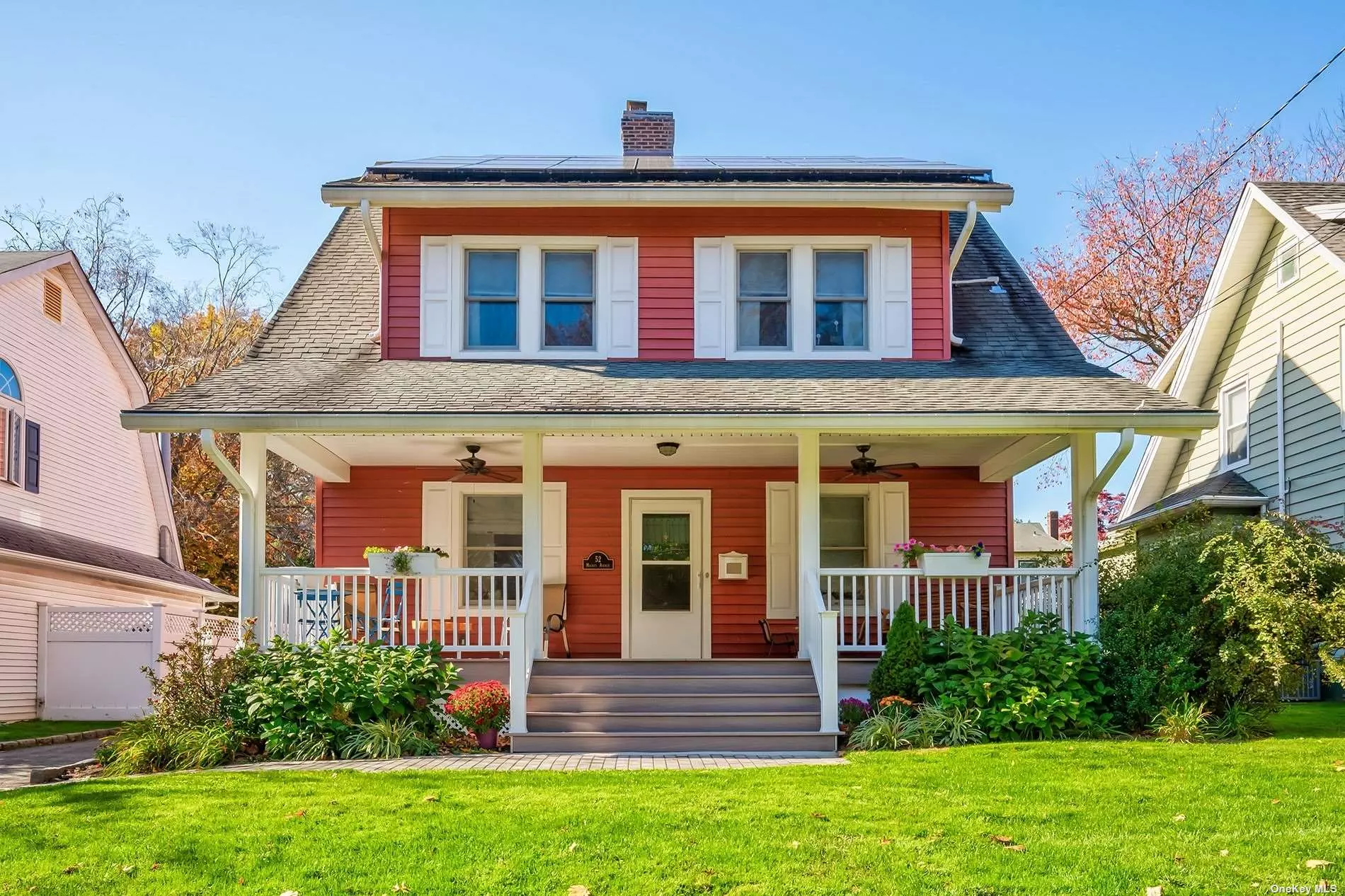 Diamond condition Colonial perfectly located in the center of all Port Washington has to offer. This wonderful home has the best of everything: Classic charm and details with high ceiling of this era, yet has been fully updated with open concept spaces for easy modern living. The oversized front porch leads you to the large entry foyer with brick fireplace and half bath. The kitchen has quartz counters, stainless steel appliances and opens to the great room and casual and formal dining areas. 3 spacious bedrooms on the second floor include a primary ensuite with outfitted walk-in closet and renovated full bath. Additional renovated full bath on this floor. 3rd floor walk-up attic and full house basement adds to the spaces of this gracious home. Owned solar panels, 5 CAC/Heat split units, smart house thermostats, Level 2 EV charger and in-ground sprinklers. Detached garage and plenty of off-street parking. Close to train, town, shops and waterfront. This house has it all!