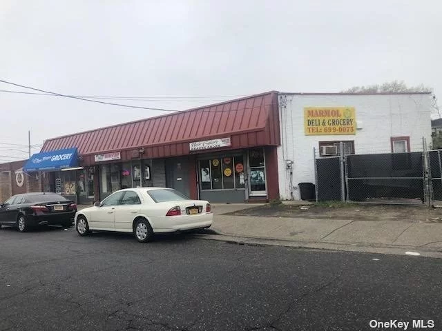 PRIME LOCATION! MINUTES AWAY FROM HOFSTRA UNIVERSITY AND THE VETERANS COLISEUM! THIS INCREDIBLE INVESTMENT PROPERTY WITH OVER 6K MONTHLY INCOME BOASTS A BEAUTY PARLOR- 850 MONTH TO MONTH, BARBER SHOP- 1350- WITH 5 YEARS LEFT ON LEASE, DELI- 2700- WITH 5 YEARS LEFT ON LEASE, AND STUDIO APT- 850 MONTH TO MONTH, FULL BASEMENT, AND ATTACHED LOT WHICH CAN PARK OVER 10 CARS, PROPERTY ZONED FOR MIX USE AND CAN BE DEVELOPED UP TO 2000 ADDITIONAL SQ FT, FULLY OCCUPIED WITH PENDING CASH FLOW! HIGH TRAFFIC AREA, CLOSE TO HEMPSTEAD VILLAGE, COURT HOUSE, BUS STATION, TRAIN STATION, AND PRESTIGIOUS HOFSTRA UNIVERSITY! SEPARATE METERS ON EACH UNIT! BUILD TO SUIT! WILL NOT LAST!