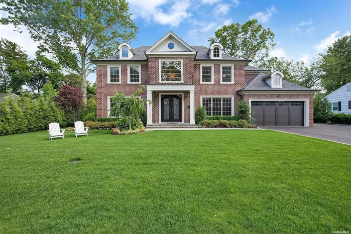 Exceptional offering in the Village of Flower Hill, Manhasset. Three years young, brick, center hall colonial by esteemed builder. Current owners added many upgrades and additional features after purchase, including but not limited to extensive privacy landscaping, slate patio with fireplace, yard fencing, custom built in closets throughout, full home audio system, and much more!!!