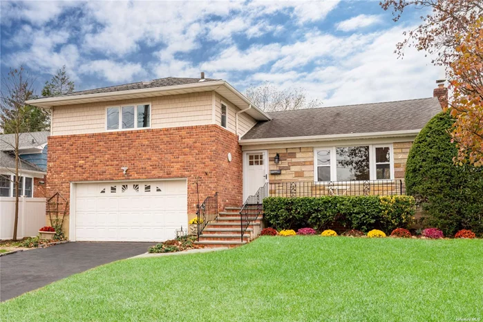 Better than new! Move right into this fully renovated brick and shingle home in the heart of Glen Cove. Spectacular eat-in-kitchen with new countertops, octagonal backsplash, new stainless steel appliances, new floor and wood cabinets. Sun filled living/dining room with hardwood floors. The second floor encompasses the primary bedroom with a new bathroom plus 2 bedrooms with full bathroom. The lower level has a generous sized den with brand new flooring, French sliders to a spacious patio and access to a double garage. Basement has ample storage, new water heater, laundry room, and utilities. Fully fenced landscaped backyard with brick barbecue. Central A/C. Close to stores and schools. Residents enjoy the multiple beaches, golf clubs, tennis and parks.