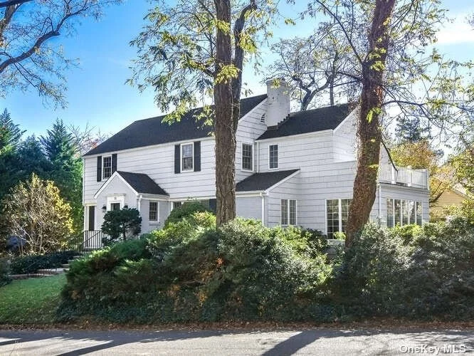 Stunning Center Hall Colonial set in prime Manhasset Bay Estates neighborhood. Features a gorgeous Primary Suite w renovated bath and amazing dressing area w 2 walk in closets plus cedar closet. French doors open to private balcony. Large sun-filled Family Room w/extensive book & tv shelving plus custom designed office space overlooking garden. Bright and spacious LR w fireplace. Formal DR. Renovated Eat-in Kitchen w marble counters. Level yard beautifully landscaped w specimen plantings to offer great privacy. Access to MB Estates beach w waterfront park.