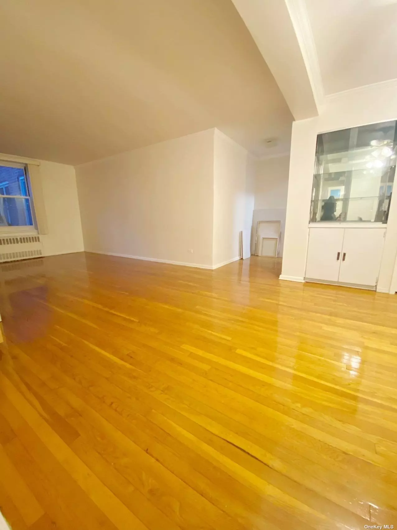 Spacious bright one bedroom co-op with excellent location and condition in heart of Flushing. Features oak hardwood flooring throughout the unit. Low maintenance is only $801.95 include water, heat and gas. Doorman lobby and common laundry room in basement in an elevator building. There are indoor parking space (waiting list). One block from the #7 line, L.I.R.R., and buses. As well as malls, shops, restaurants and more. No Subletting.