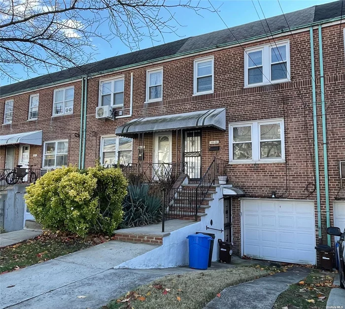 Two Story Brick Townhouse With One Car Garage Attached And Walkout Basement In Prime Location Of Fresh Meadows, 3 Bedrooms 1.5Bath, Private Backyard, One Year Roof, New Water Tank, School District #26, Express Buses Qm4/QM44 to Manhattan, Q64 to Forest Hills: LIRR, E, F, Q65 to Flushing, Convenient To All.