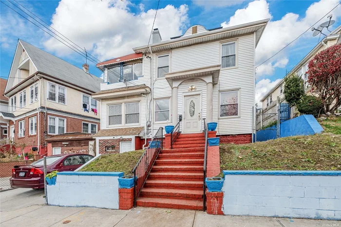 This is a Single Family detached colonial in the highly sought out area of Briarwood, Queens. One of the highlights is that it sits on a 40 x 173 (6, 9220 sq ft) irregular lot with the possibilities to build more. It needs a little TLC but has lots of potential. This home features a foyer, cozy living room with fireplace, formal dining room, 3 bedrooms on the second floor and a full basement with an outside separate entrance. This house also has original parquet solid hardwood floors throughout, a private driveway and Solar Panels. Location to public transportation is ideal! It is walking distance to the Parsons Blvd & Jamaica Center subway station, E & F subways and the Q43, Q25, Q34 bus. Close to the Grand Central Parkway and Van Wyck Expy, schools, parks, museums, places of worship, restaurants and shops.