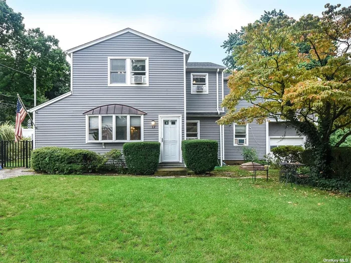 Expansive and updated Colonial set back off the street with a whole lot to offer! Renovated within the last few years, this home features new hardwood floors, large living room/dining room area open to marble kitchen with stainless steel appliances and designated mudroom/laundry. First floor guest room, home office, and updated full bathroom with stall shower. Second floor full master suite with dual walk-in closets, three additional bedrooms and updated hall bath. Finished basement with storage, gaming/play room and outside entry. Large front yard, fenced in backyard/play area, attached one-car garage, etc. Prime location close to shopping, schools and public transit.