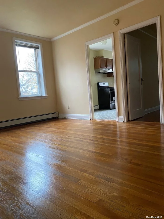 Spacious apartment on first floor, living room, kitchen, bedroom and bathroom. Tenant pays for cooking gas, electric and heat. No pets. Close proximity to LIRR. Street parking.