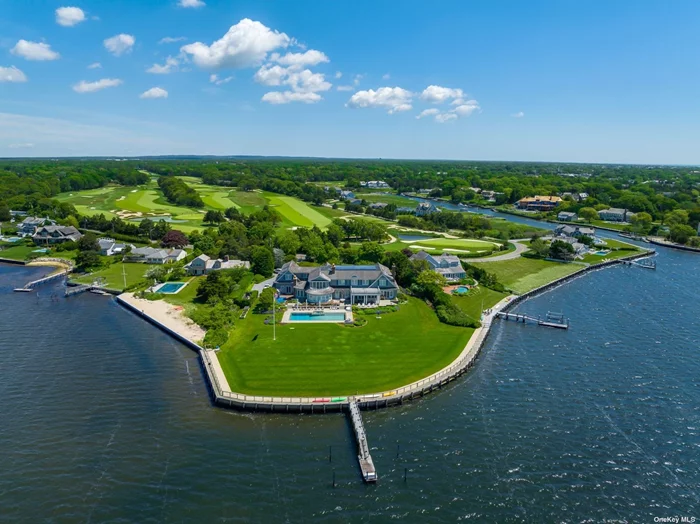Introducing The Point, an exquisite waterfront estate situated on 2 acres with 380 feet +/- of frontage on Moriches Bay, a private dock and separate carriage house. Located on one of the most premier waterfront sites in the Hamptons, this brilliantly designed and executed custom home by architect Craig Arm and appointed by interior designer, Bunny Williams, features an 8 bedroom, 9.55 bath main house and 2 bed, 2 bath carriage house with the finest materials and details throughout. Ideal for entertaining on any scale - inside and out - this stunning house is complete inside with a state of the art dream kitchen, butler&rsquo;s pantry, atrium, morning room, formal dining room, great room, study, and gym. Outside, enjoy this peninsula-like exclusivity in the multiple covered sitting areas, by the 50 x 24 gunite zero-edge pool with built in spa, and take in the beautiful panoramic views of both the sunrise and sunset. Additional features include geothermal heating and cooling and generator. With close proximity to Westhampton Country Club, the revitalized Westhampton Beach Main Street, some of the best ocean beaches in the country, this spectacular waterfront estate is not to be missed.