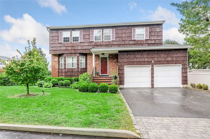 Spacious Four bedroom 2.5 Bath Colonial on a quiet mid block location. Formal Living room w/Bay Window, Formal Dining Room open to the eat in Kitchen, Large Den with Wood burning Fireplace and Sliders to the Yard Area. Large Primary Bedroom w/ensuite bath & walk in closet. Full unfinished Basement. Two Car Garage with direct entry into the home. 200 Amp service. Central Air Conditioning.