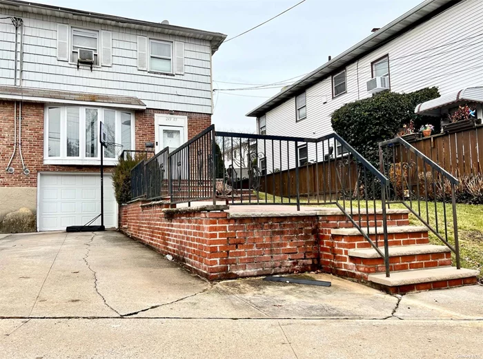 Two-family semi-detached building in a well sought after Douglaston neighborhood. 1st and 2nd floor each with 3 bedroom and 2 full bath setup. Central A/C system for 1st floor. Full basement is partially finished and has separate outside access. Attached 1 car garage with a long driveway. (Sold as -is )