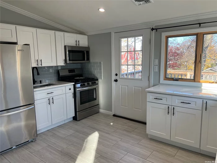 Newly Renovated Luxury 2 Bedroom 1 bath 2nd Floor Apartment For Rent In The Village Of Lindenhurst. Private entrance leading up to an Open Concept Kitchen/Living Room With A Private Deck. Kitchen is Granite Countertops With SS Appliances. No Expenses Spared. Street Parking Available. No Laundry In Unit but could add, No Pets, Utilities Included.