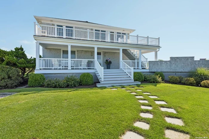 This light-filled four bedroom, three and a half bath custom home on the bay takes maximum advantage of the panoramic water views with generous south facing and west facing decks on both levels. Situated on a just-shy acre, there is access to the bay and a boardwalk to your private dock. Second floor open concept living areas showcase the views of Moriches Bay through glass doors and large windows on three sides. Enjoy a large deck around a bay side pool