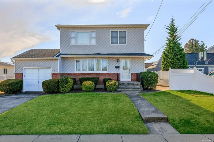 Meticulously maintained: Features updated windows including the basement. Updated siding. Hardwood floors. Tremendous basement with bath and dry bar. PVC fencing. Patio with electric awning. IGS .