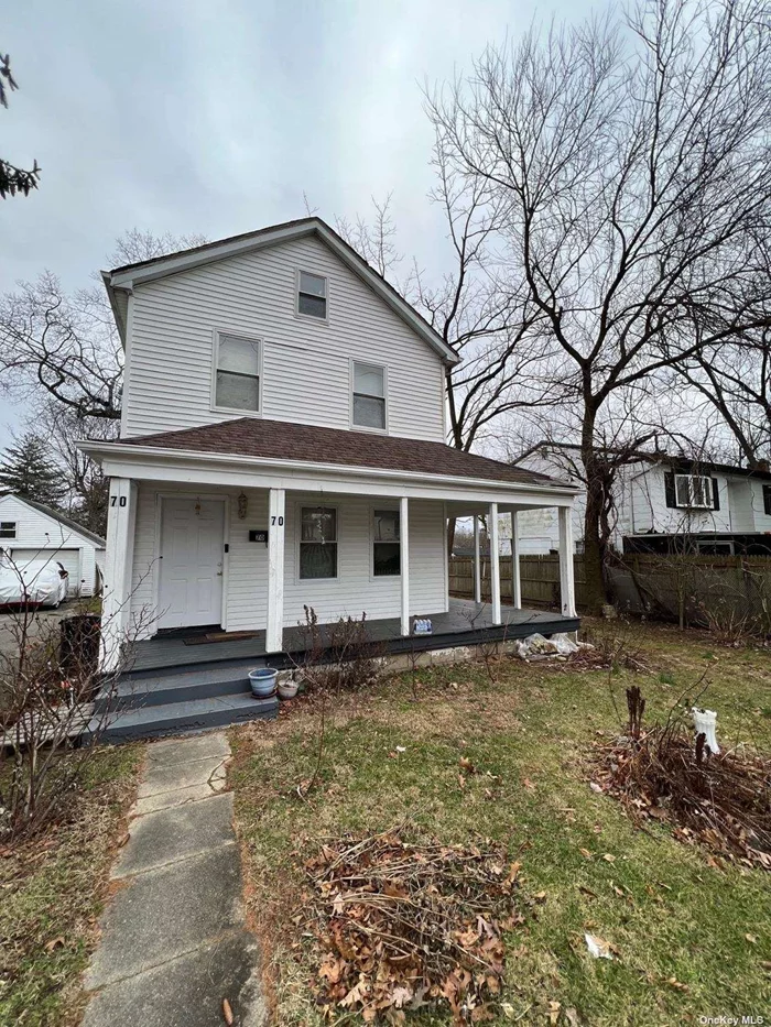 3 bedrooms, 1.5 bathrooms, EIK, LR, den, basement is a large utility space with inside access, front porch, 2-car detached garage, needs TLC, close to stores.  Low Taxes !!!
