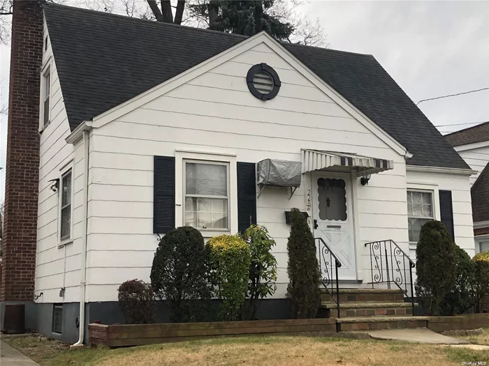 Lovely Cape with a Mid-Block Location. Three Levels of Living Space, Hardwood Oak Floors, Four Bedrooms, 2 Full Baths, Full Partially Finished Basement. Handicap Access, Rear Entrance Lift/Elevator.