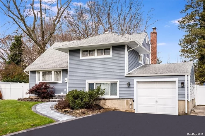 This updated split-style home offers three bedrooms and two full bathrooms in a quiet street mid-block. The home has endless updates, including a 7-year-old roof, brand new siding, a new front stoop, a new driveway, a 3-year-old back patio pavers, a brand new CAC, and a 200AMP panel with a 220 for EV charging. A completely redone full bath is located upstairs. Under all carpeting, there is hardwood flooring. The living room and kitchen have been freshly painted. The kitchen has granite countertops and new tile flooring. A two-zone heating system. Front and back IG sprinklers. Fantastic move-in ready home.