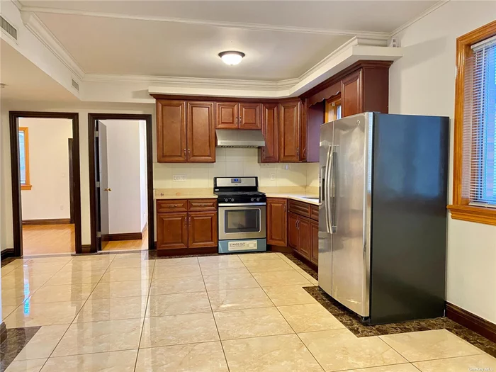 Beautiful facing south house was build in 5 years only. 3 bedrooms unit come with 1 master room with full bath . Updated kitchen and terrestrial heated floor. Near public transportation: Q46?Q25 and Q65 bus to down town Main street#7 line and LIRR. Near school, near shopping area also, etc. Must see!