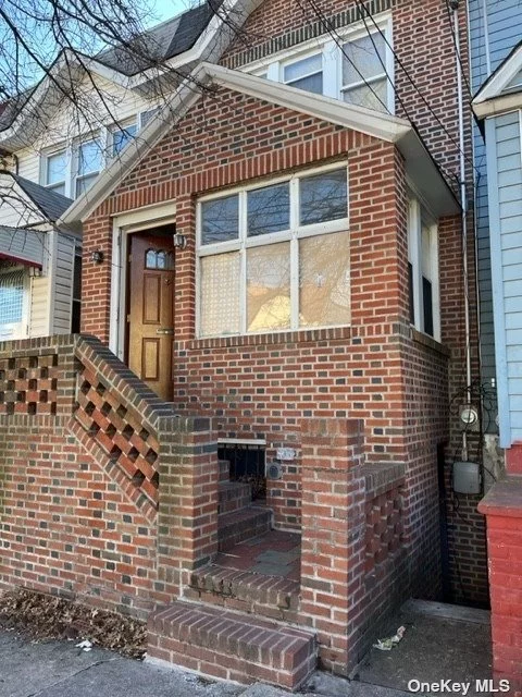 One family house brick located within walking distance of #7 elevated train line on Junction Blvd/ Roosevelt Av and Q58 bus which transfer to the R train (Grand Ave & Newtown station) just around the corner. 1304 SQF of living space with a formal living room, dining room and eat in kitchen on the first floor. Second floor is divided into a large Master bedroom, 2 more bedrooms and a full bathroom. Full finished basement with laundry room and private front entrance. Basement can be an entertainment room with bar, or converted into a family room. Back yard accessed via community driveway, with space for 2 car parking. Restaurants, grocery stores, supermarket, medical offices and hospital nearby.